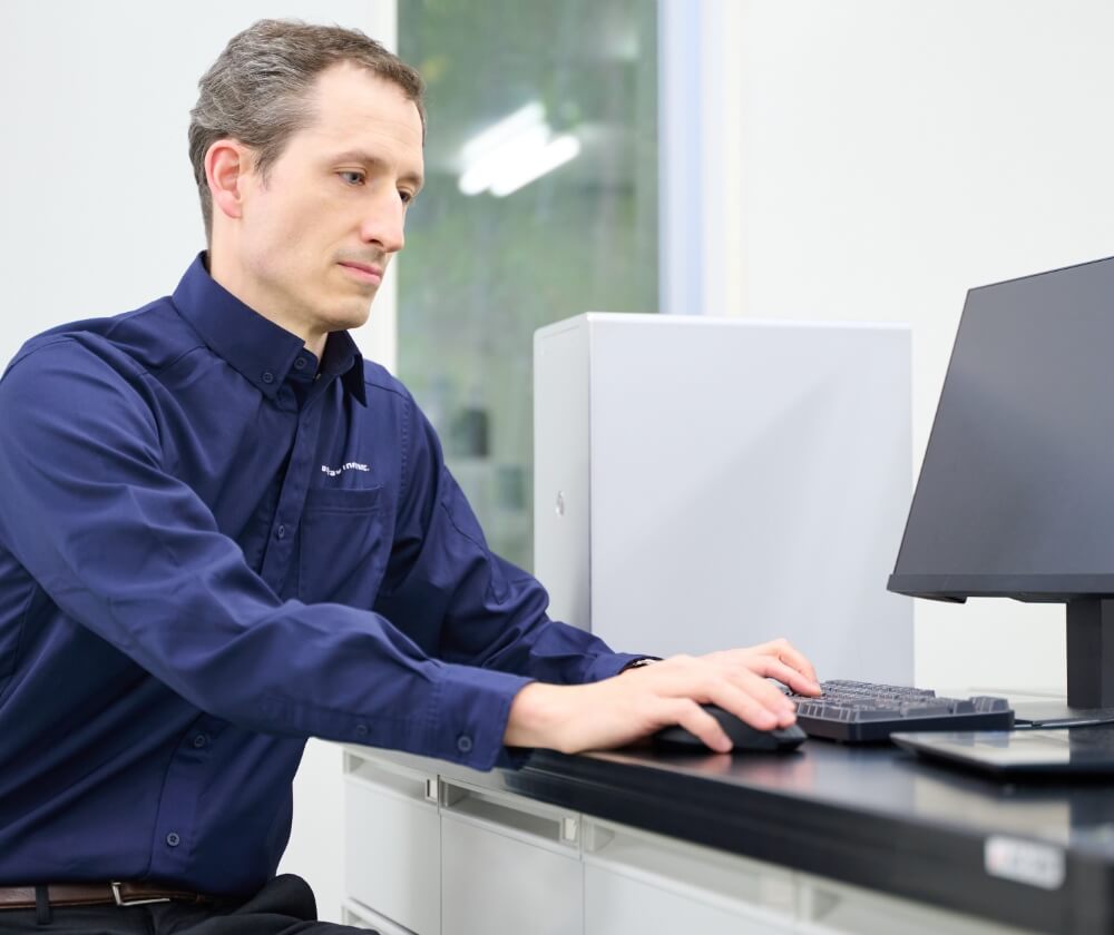 A man is operating a computer